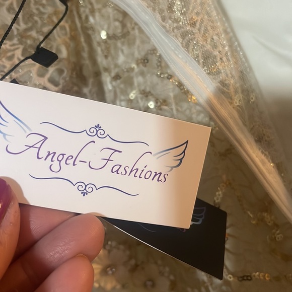 New with tags cream evening gown with champagne gold sequined overlay lace. - Picture 9 of 13